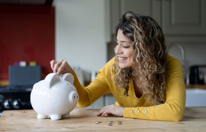 Women saving money piggy bank