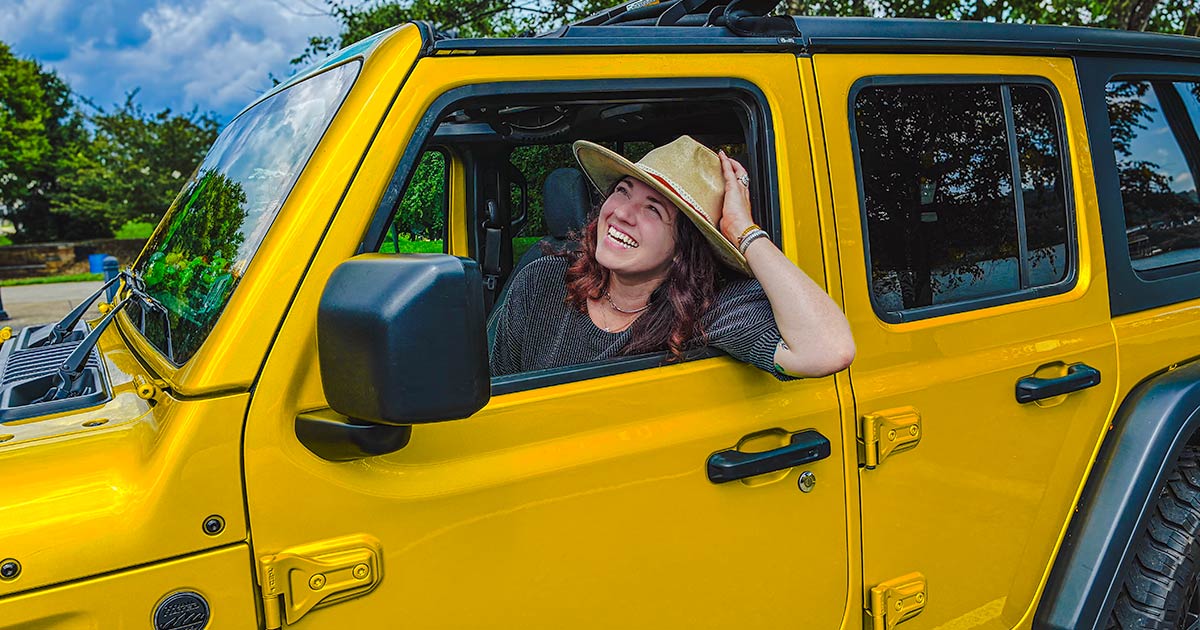 woman in yellow jeep