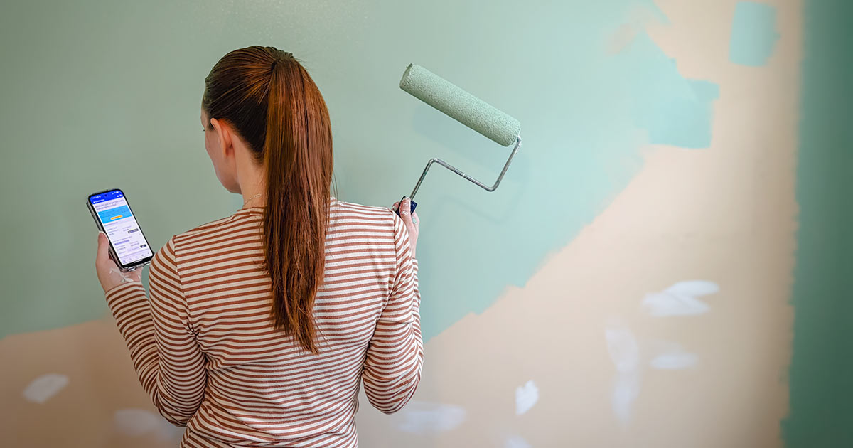 woman painting room aqua