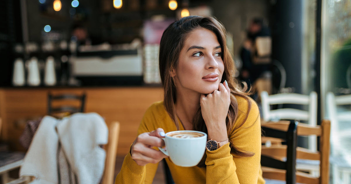 woman drinking coffee in a cafe