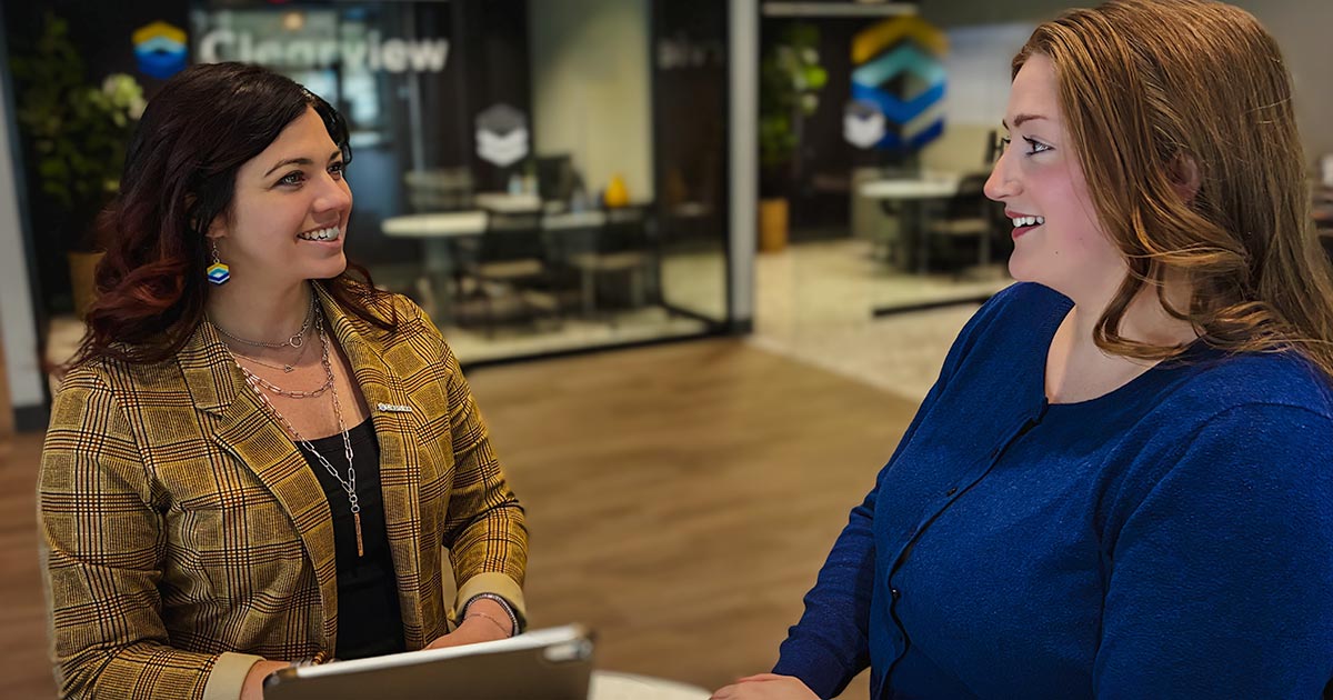 smiling staff assisting member