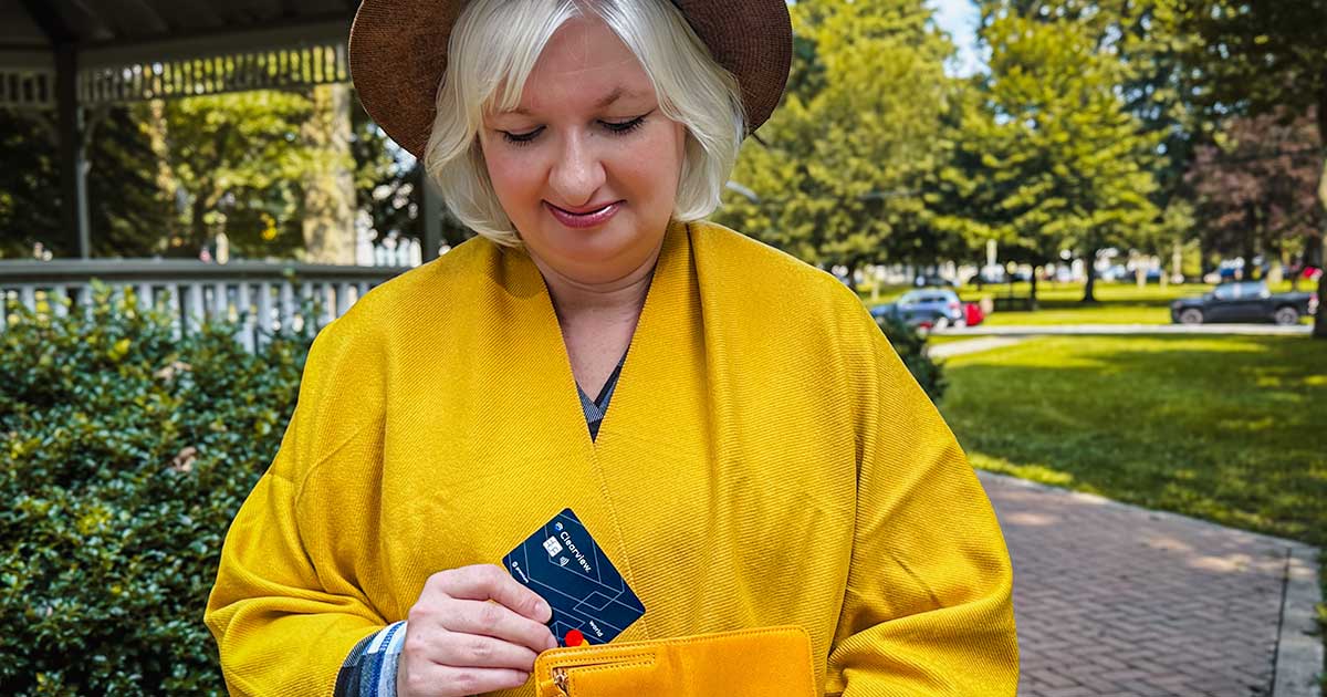 woman with credit card in park