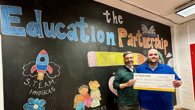 Gallery Image: Nate with recipient, The Education Partnership