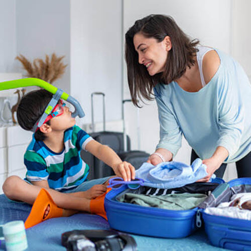 mom and son packing